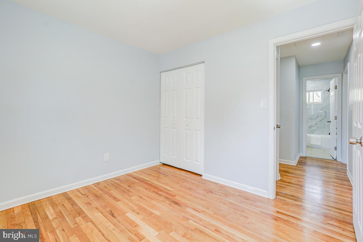2654 Cory Terrace Silver Spring, MD 20902 - Photo 20 of 32 a view of a room with wooden floor and a bathroom