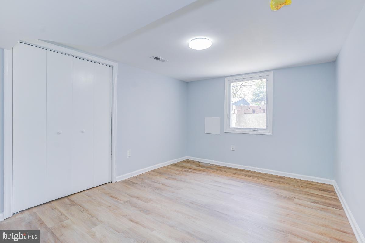 2654 Cory Terrace Silver Spring, MD 20902 - Photo 25 of 32 wooden floor in an empty room with a window