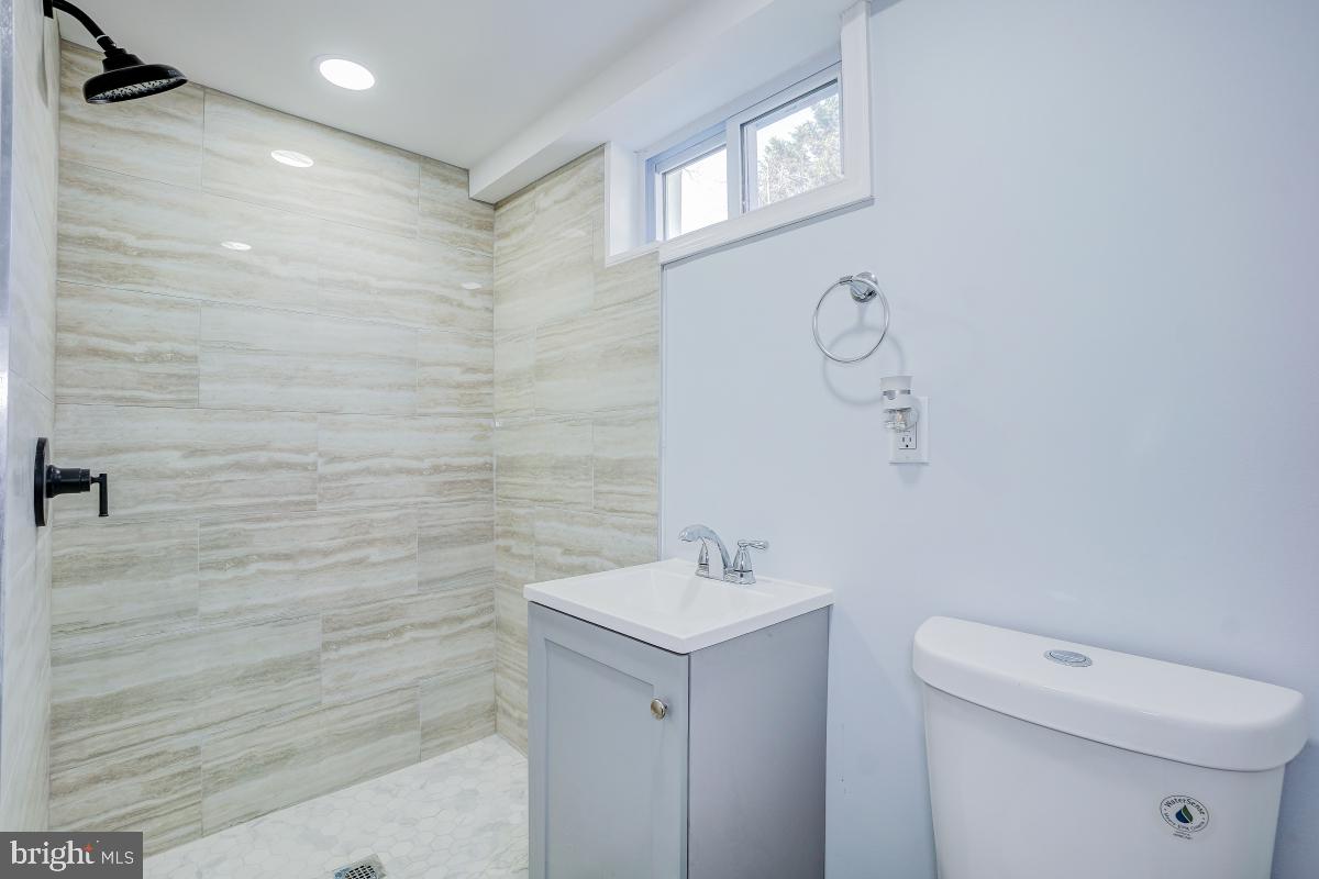 2654 Cory Terrace Silver Spring, MD 20902 - Photo 26 of 32 a bathroom with a sink a toilet and shower