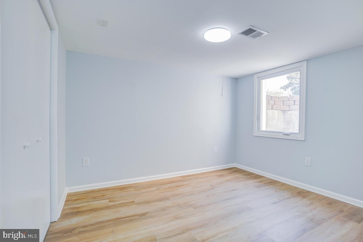 2654 Cory Terrace Silver Spring, MD 20902 - Photo 27 of 32 wooden floor in an empty room with a window