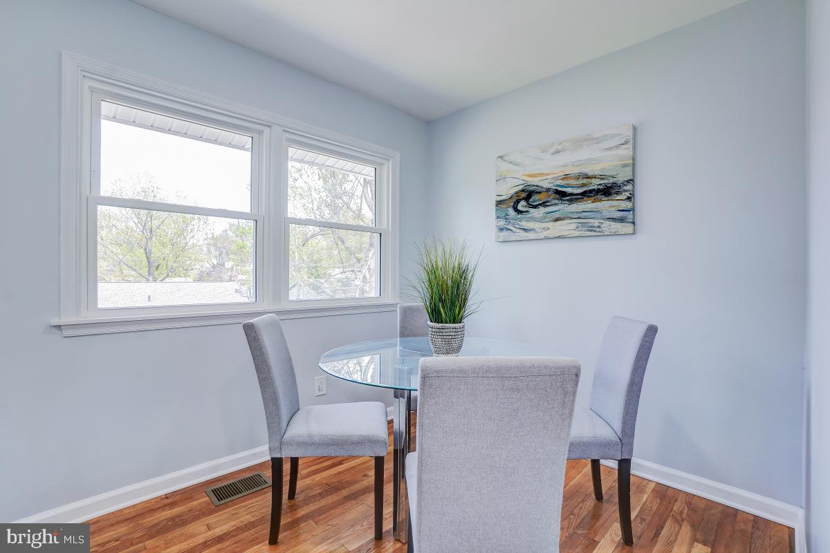 2654 Cory Terrace Silver Spring, MD 20902 - Photo 9 of 32 a view of a dining room with furniture window and wooden floor