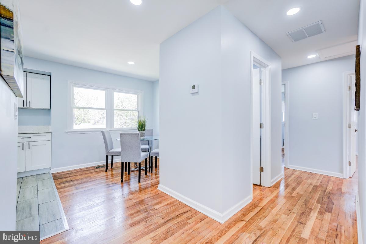 2654 Cory Terrace Silver Spring, MD 20902 - Photo 10 of 32 a view of a room with wooden floor lounge chair and windows
