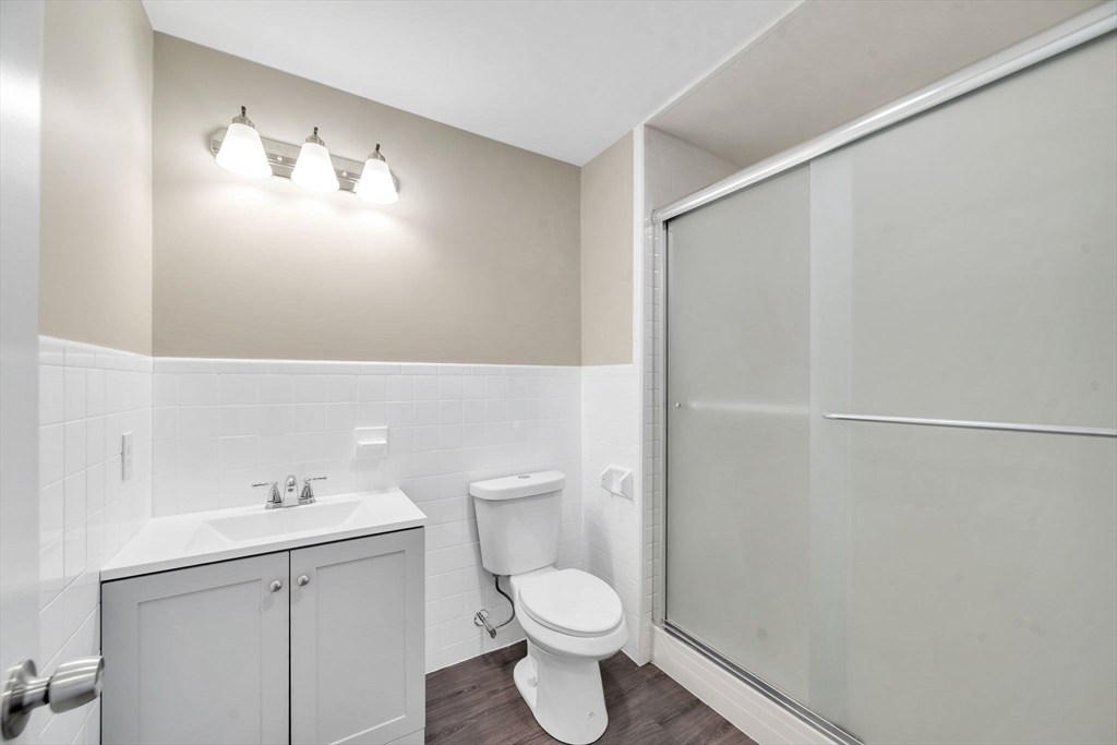 230 Gilbert Avenue Springfield, MA 01119 - Photo 31 of 40 a white toilet sitting next to a bathroom sink