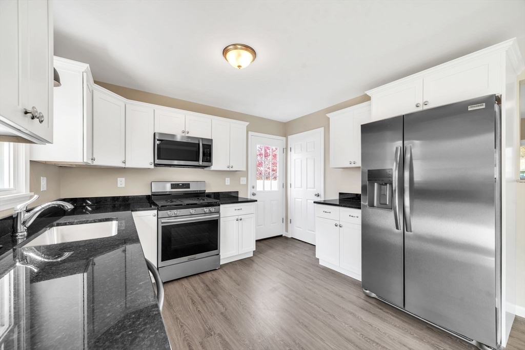 230 Gilbert Avenue Springfield, MA 01119 - Photo 4 of 40 a kitchen with a refrigerator stove and sink