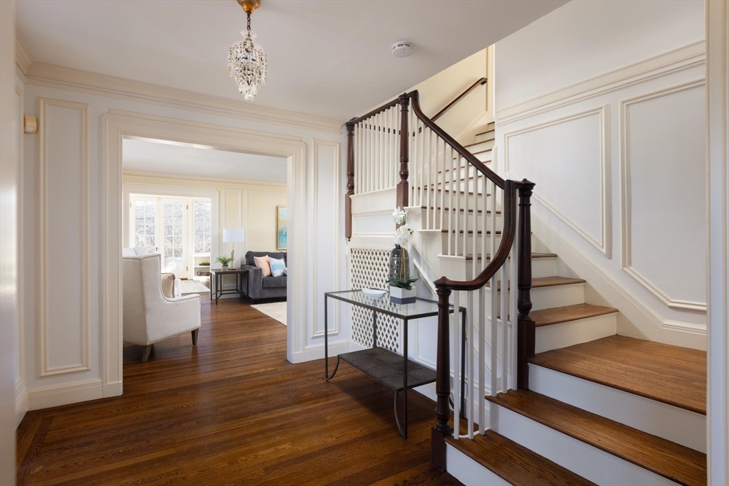 10 Locke Road Newton, MA 02468 - Photo 2 of 16 a view of an entryway with wooden floor a mirror and a view of bedroom