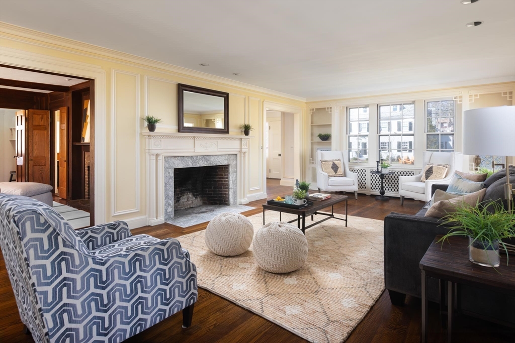 10 Locke Road Newton, MA 02468 - Photo 3 of 16 a living room with furniture and a fireplace