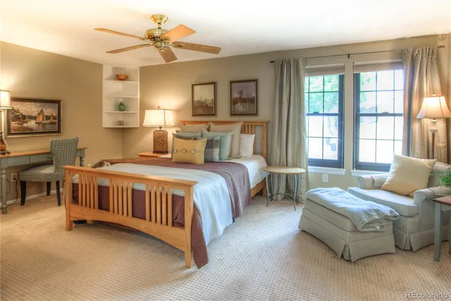 a bed room with two beds and a chandelier