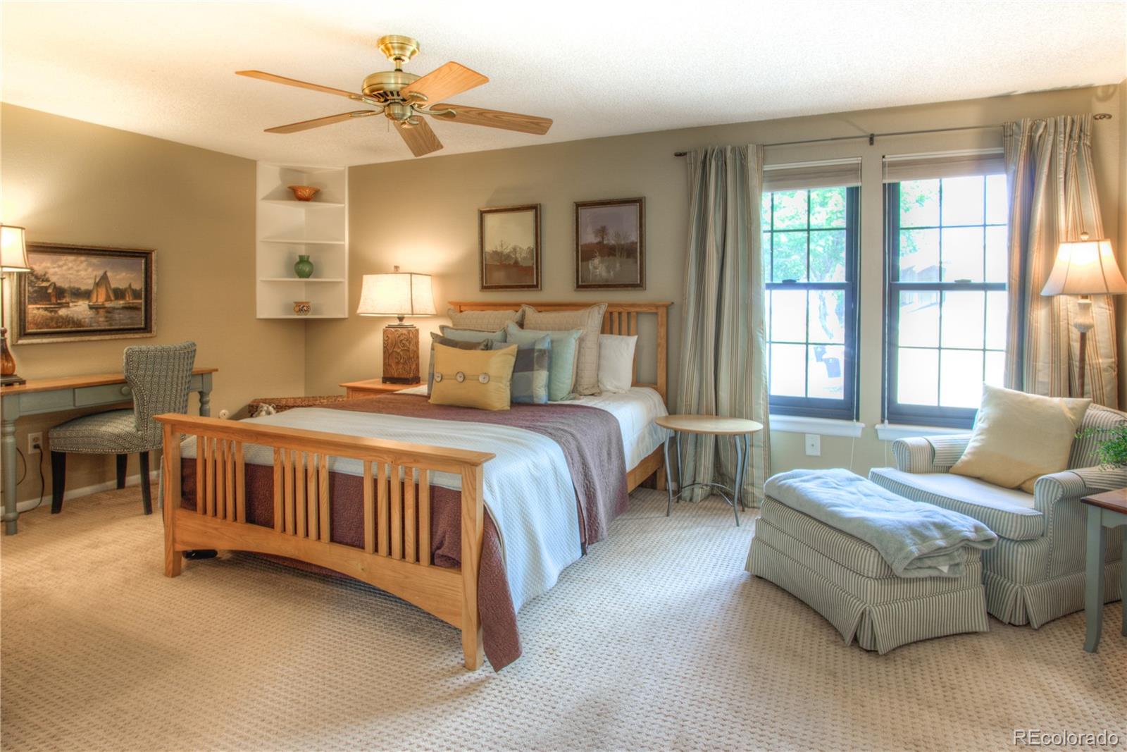 11703 West Elk Head Range Road Littleton, CO 80127 - Photo 11 of 46 a bed room with two beds and a chandelier