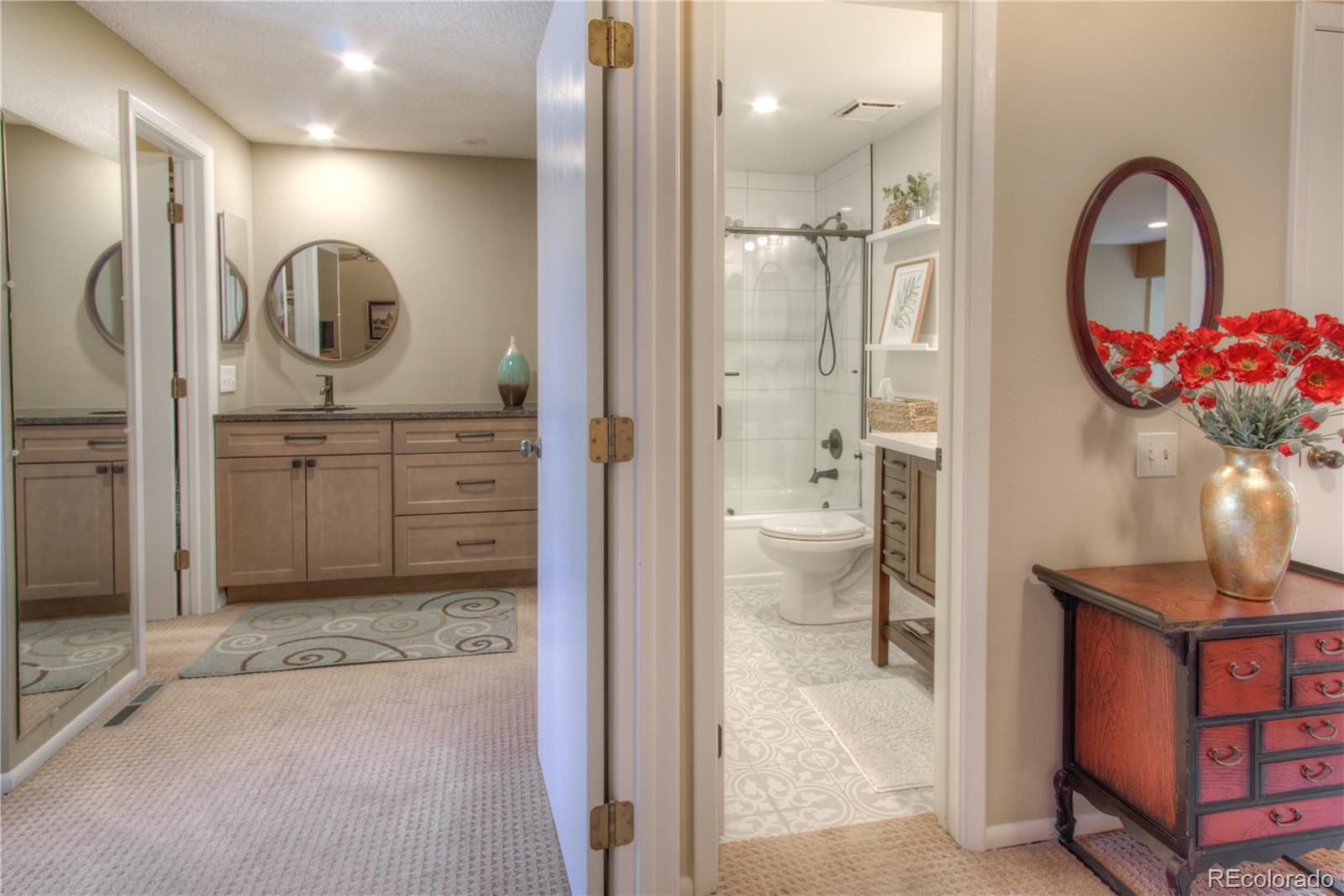 11703 West Elk Head Range Road Littleton, CO 80127 - Photo 14 of 46 a bathroom with a sink a toilet and a mirror