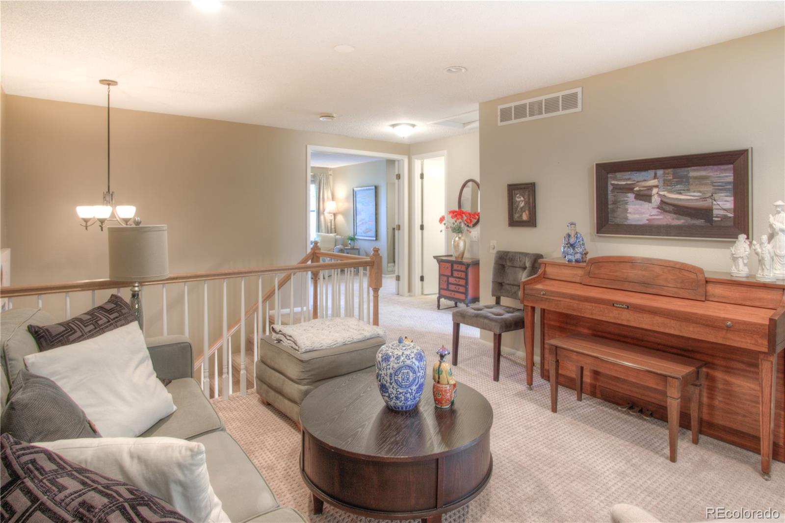 11703 West Elk Head Range Road Littleton, CO 80127 - Photo 21 of 46 a living room with furniture and a wooden floor