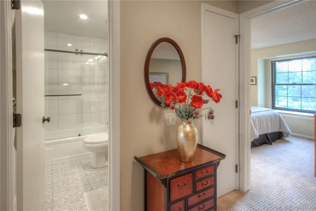 a bath room with a toilet and a shower