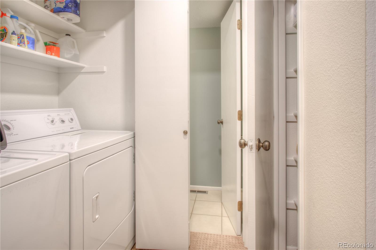 11703 West Elk Head Range Road Littleton, CO 80127 - Photo 26 of 46 a utility room with dryer and washer