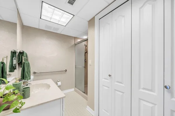 a bathroom with a sink a toilet and mirror