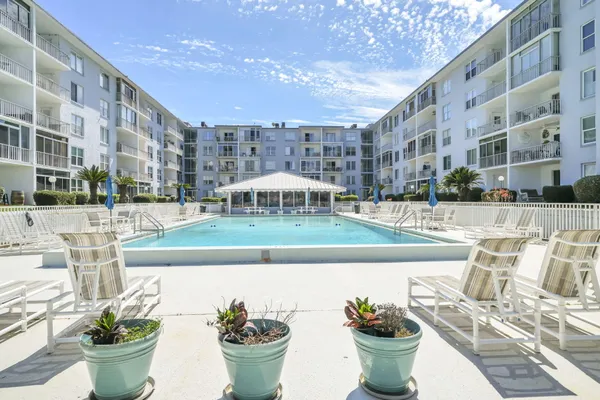 a view of a swimming pool with a patio