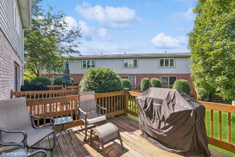 a view of a patio with a table and chairs