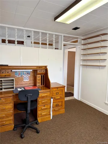 a room with a bed and a chandelier