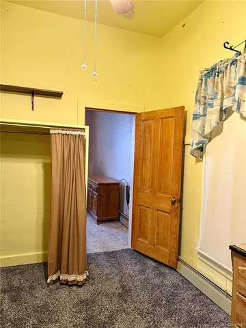 a hallway with a sink and a refrigerator