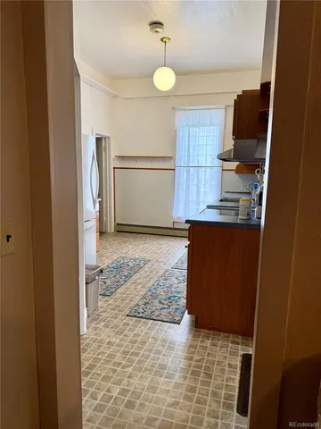 a bathroom with a toilet a sink and a mirror