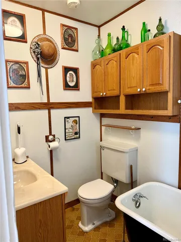 a view of a livingroom with furniture and cabinet
