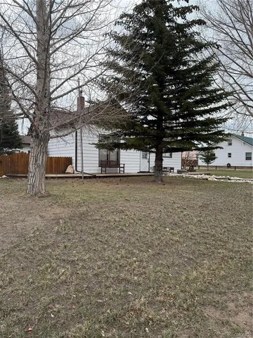 a view of a house with a snow on the road