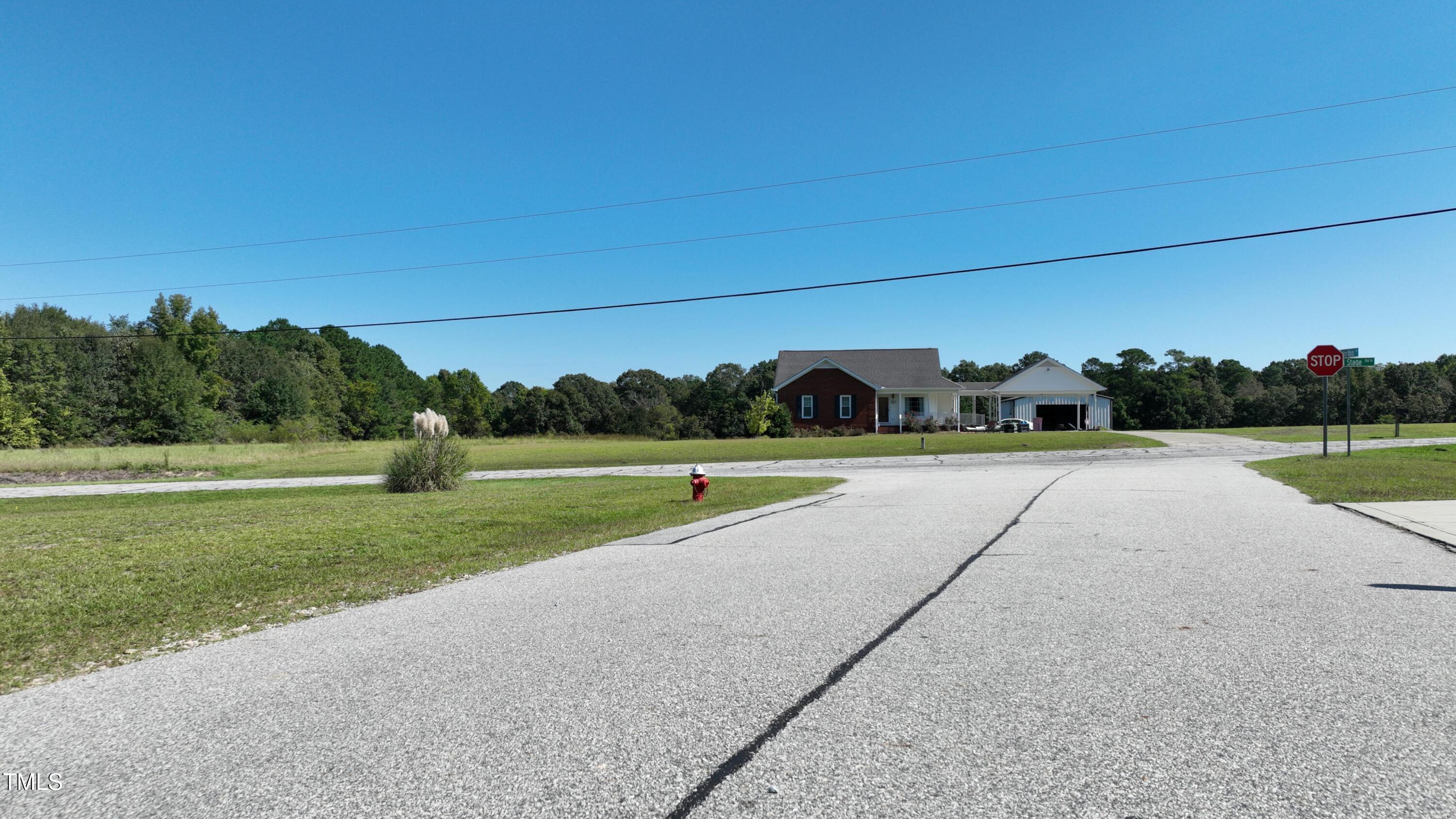 0 Old Stage Road North Angier, NC 27501 - Photo 15 of 17 a view of a green field with clear sky