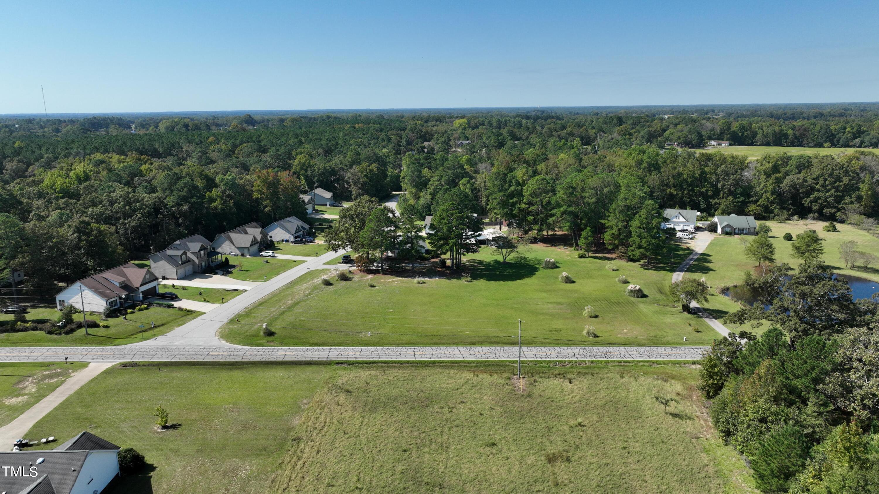 0 Old Stage Road North Angier, NC 27501 - Photo 4 of 17 a view of a lake with a yard