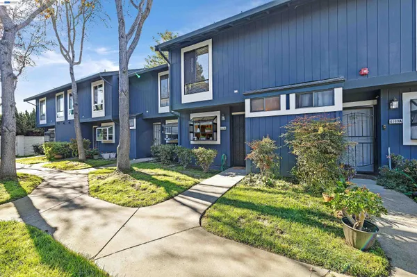 a kitchen with stainless steel appliances granite countertop a stove and cabinets