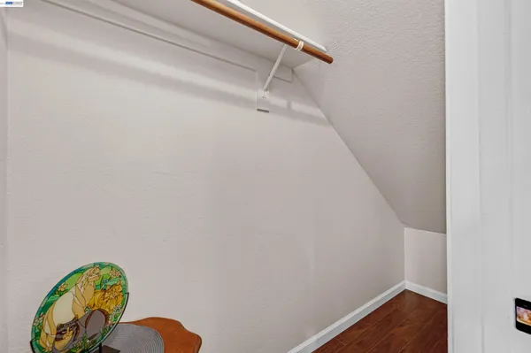a view of a hallway with a wooden floor