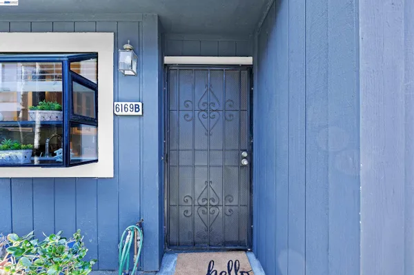 a kitchen with stainless steel appliances granite countertop a refrigerator and a stove
