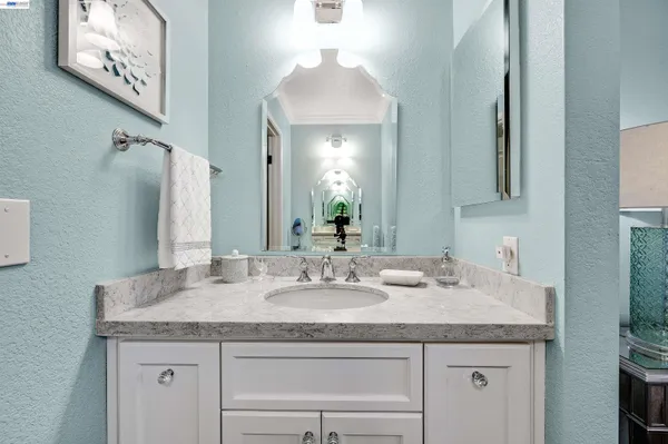 a backyard of a house with chairs and a table and chairs