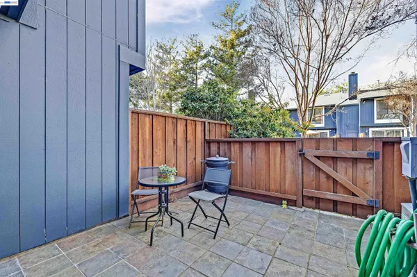 a picture of a bench in front of a wall