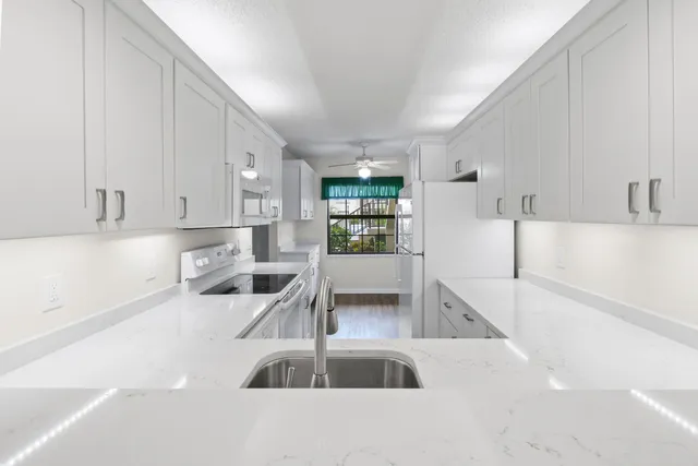 a view of a room with drop ceiling