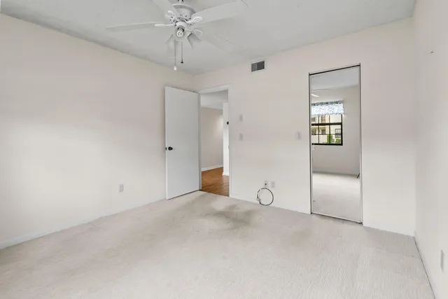 a view of a swimming pool and an outdoor seating
