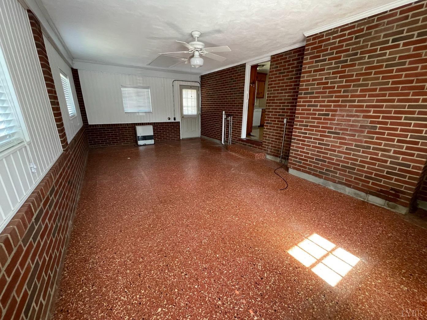 363 Lynbrook Road Rustburg, VA 24588 - Photo 14 of 19 wooden floor in an empty room with a window