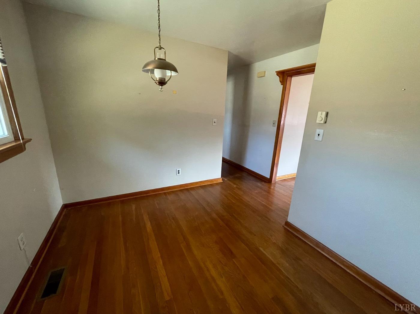 363 Lynbrook Road Rustburg, VA 24588 - Photo 5 of 19 a view of a room with wooden floor and windows