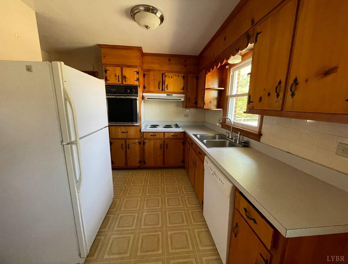 363 Lynbrook Road Rustburg, VA 24588 - Photo 7 of 19 a kitchen with a refrigerator sink and stove