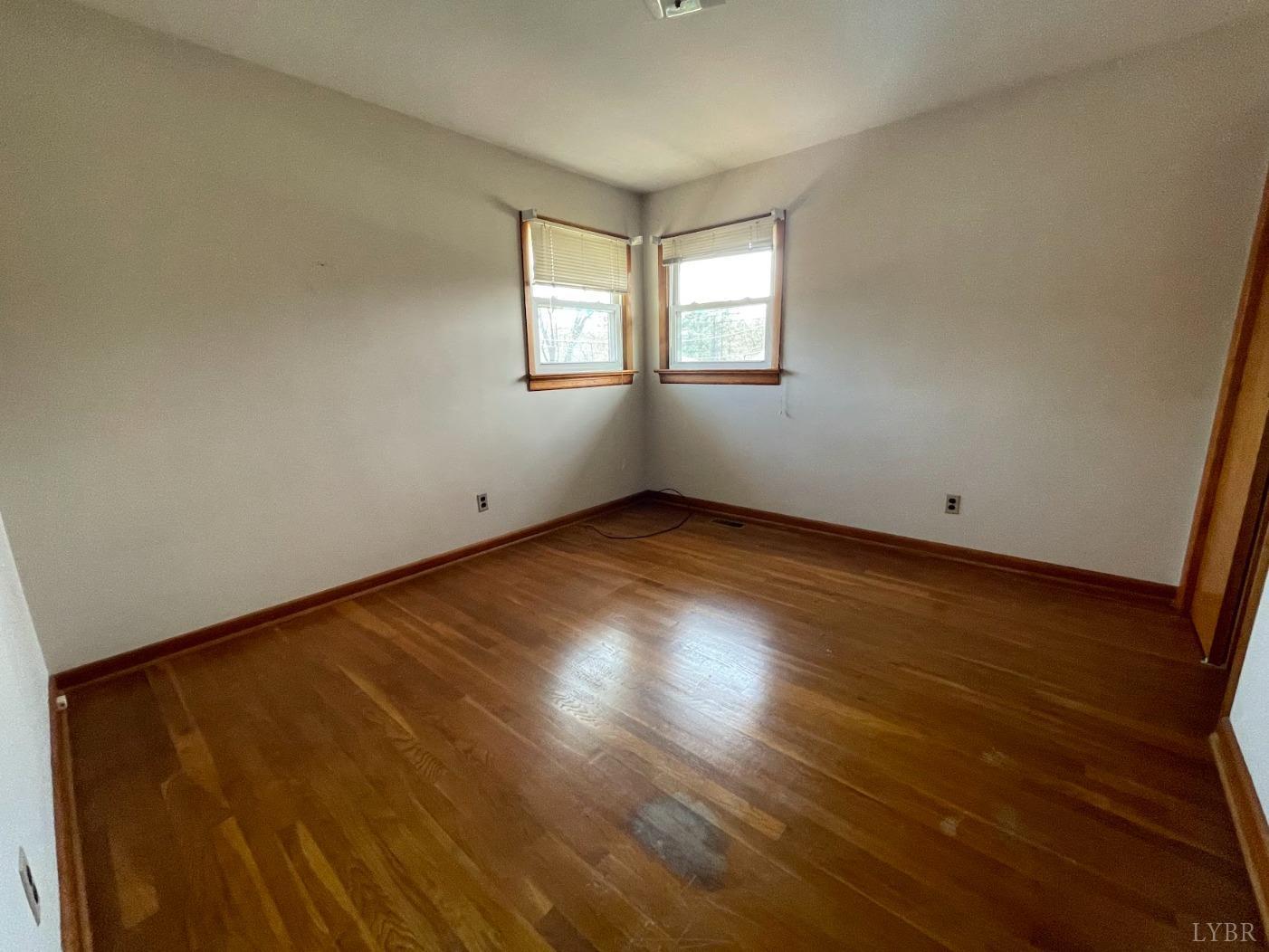 363 Lynbrook Road Rustburg, VA 24588 - Photo 8 of 19 a view of an empty room with wooden floor and a window