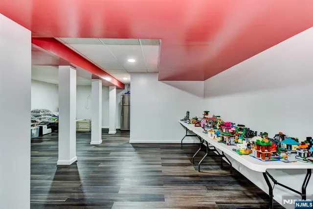 a hallway with wooden floor and toys