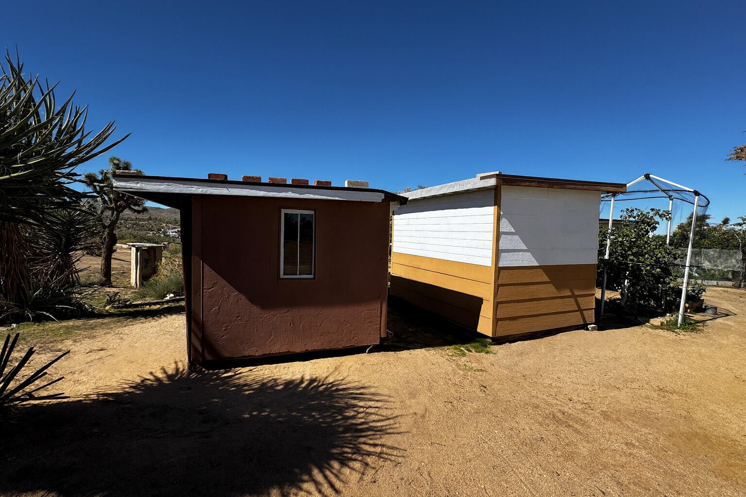56606 Skyline Ranch Road Yucca Valley, CA 92284 - Photo 14 of 19 a view of a car park in front of a house