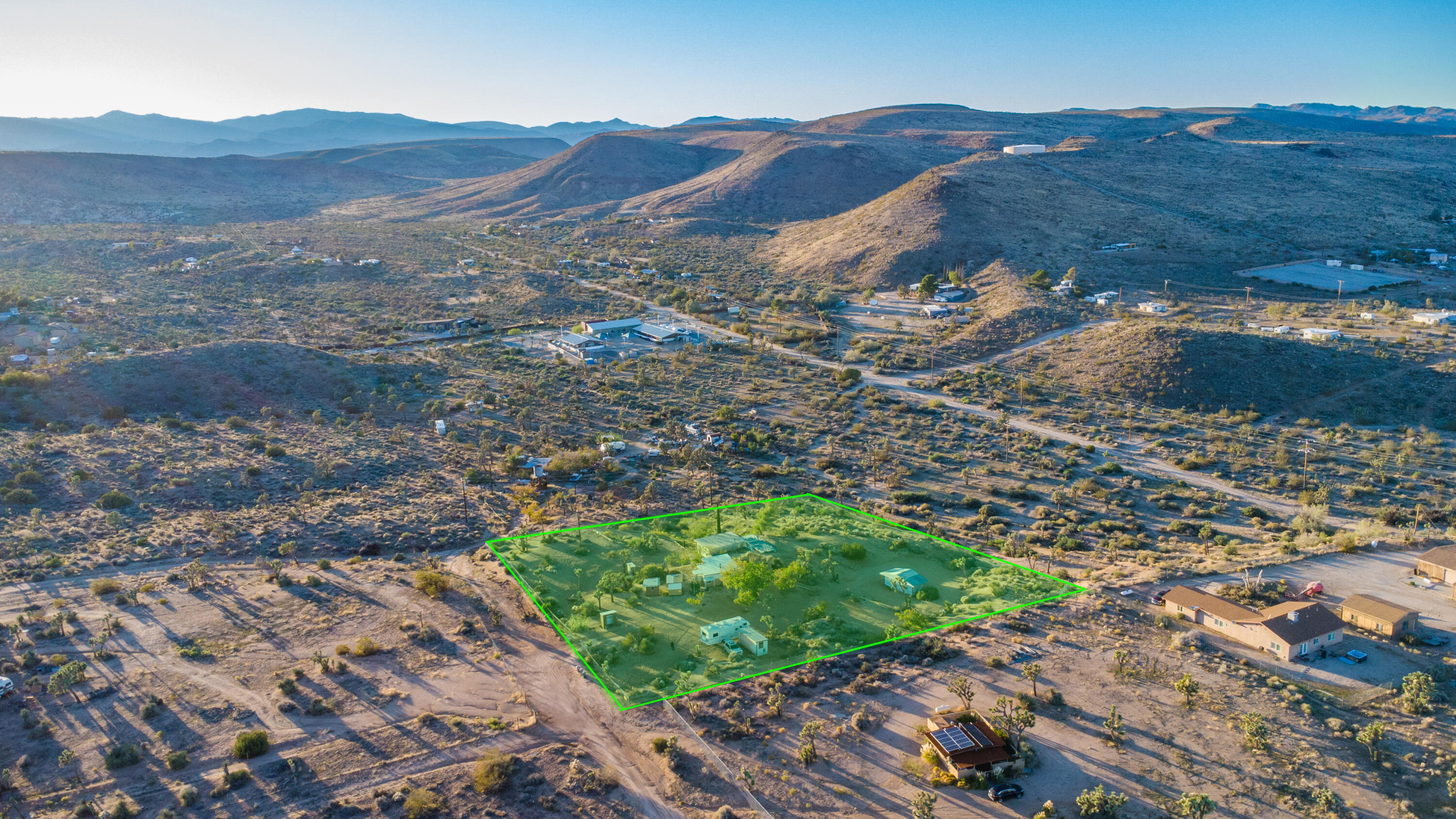 56606 Skyline Ranch Road Yucca Valley, CA 92284 - Photo 16 of 19 a view of a lush green hillside and houses