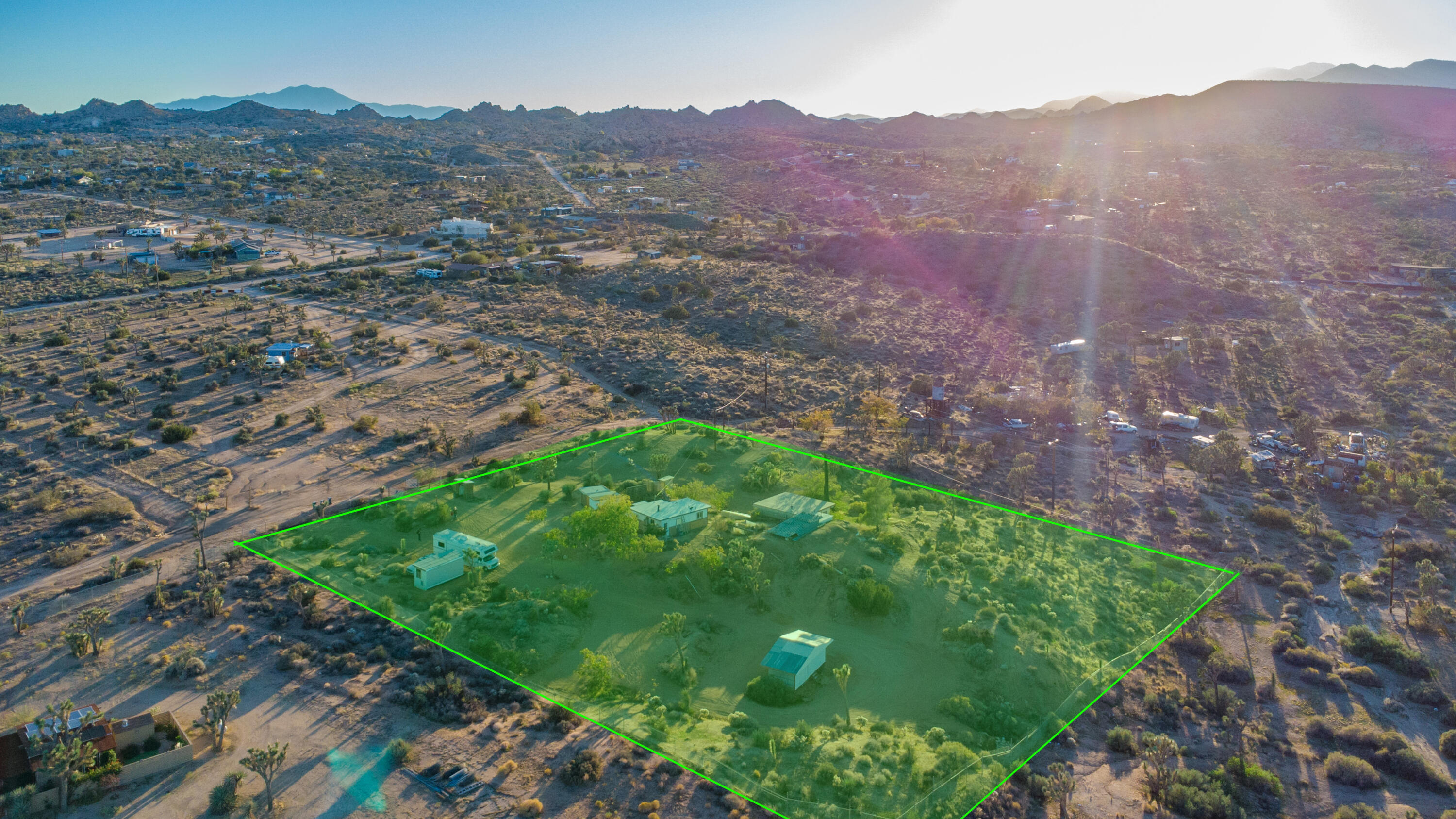 56606 Skyline Ranch Road Yucca Valley, CA 92284 - Photo 17 of 19 a view of a lush green hillside and a building