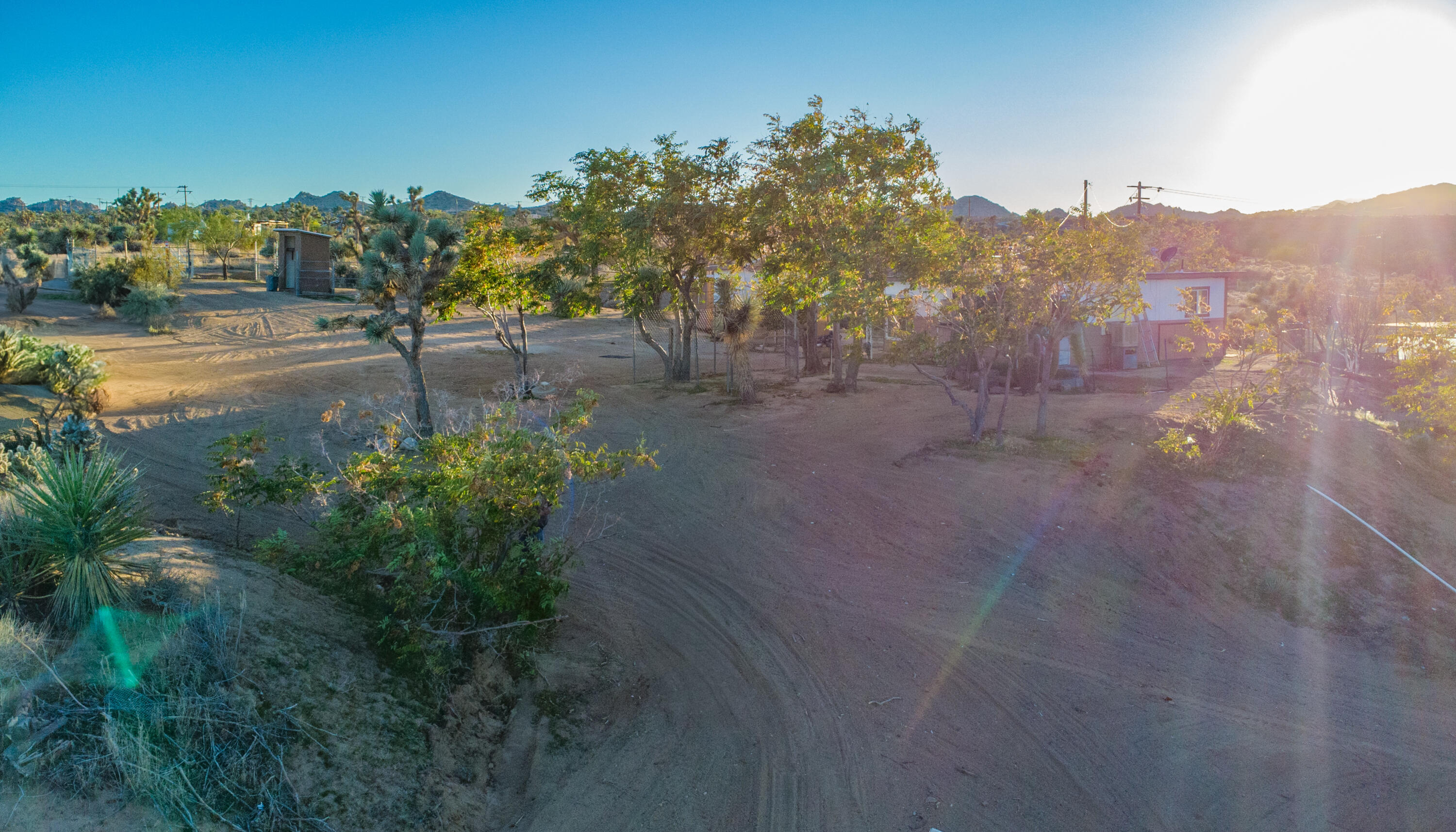 56606 Skyline Ranch Road Yucca Valley, CA 92284 - Photo 19 of 19 a view of a pathway with a garden