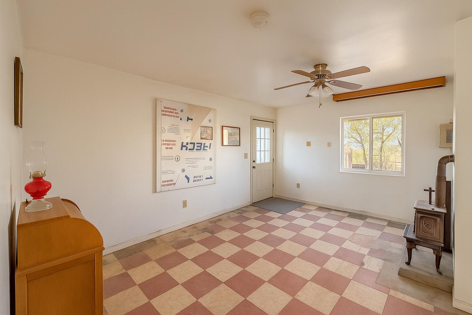 56606 Skyline Ranch Road Yucca Valley, CA 92284 - Photo 4 of 19 a bedroom with a bed and a chandelier