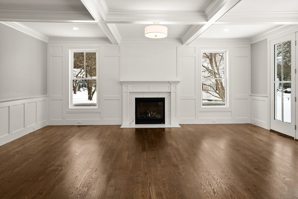 17 Saddle Club Road Lexington, MA 02420 - Photo 9 of 32 an empty room with wooden floor fireplace and windows