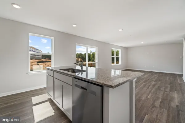 a kitchen with sink and window