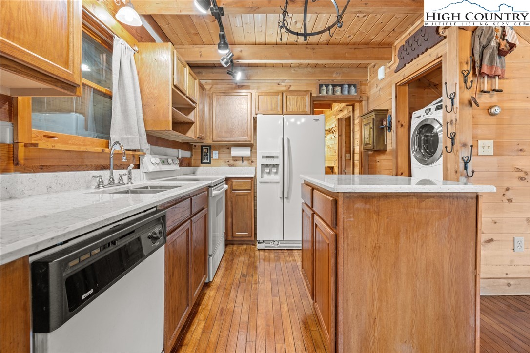 183 Laurel Branch Road Vilas, NC 28692 - Photo 11 of 39 a kitchen with stainless steel appliances granite countertop a stove and a refrigerator