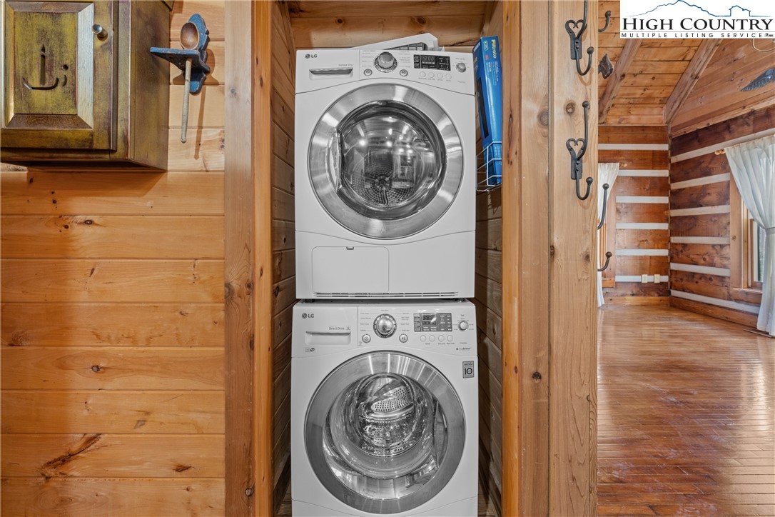 183 Laurel Branch Road Vilas, NC 28692 - Photo 13 of 39 a view of a hallway with washer and dryer