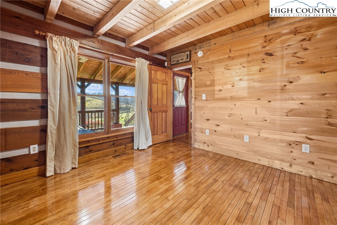 183 Laurel Branch Road Vilas, NC 28692 - Photo 14 of 39 a view of an empty room and wooden floor