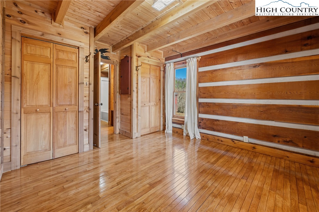 183 Laurel Branch Road Vilas, NC 28692 - Photo 15 of 39 a view of empty room with wooden floor and fan
