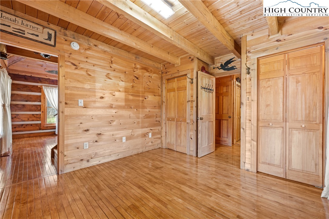 183 Laurel Branch Road Vilas, NC 28692 - Photo 16 of 39 a view of walk in closet with wooden floor